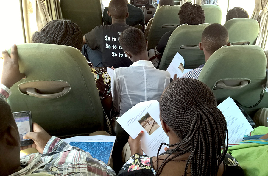 Enumerators reading the manuals on the way to do the pilot exercise: