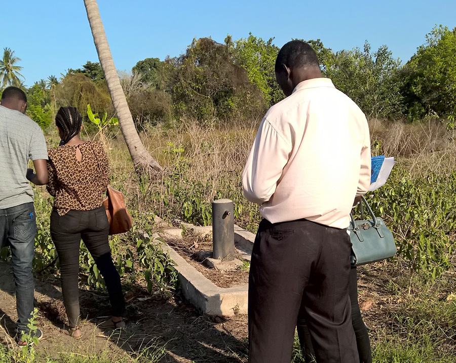 Enumerators verifying a water point during the pilot exercise: